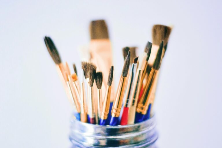 Collection of various paintbrushes in a jar ready for artistic projects.